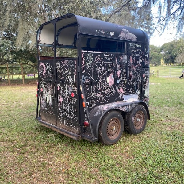 a truck is parked in the grass
