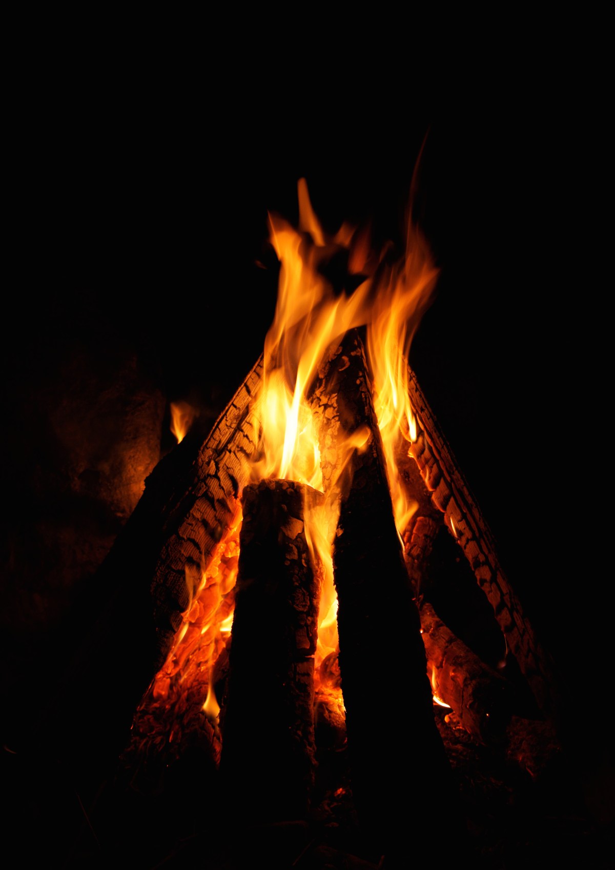 a large fire in a dark room